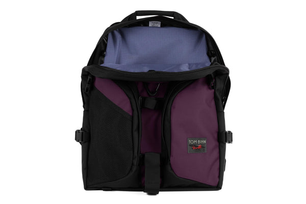 A Brain Bag in Aubergine Ballistic with a Dusk (dark purple with purple grid) 210 Cerylon interior.